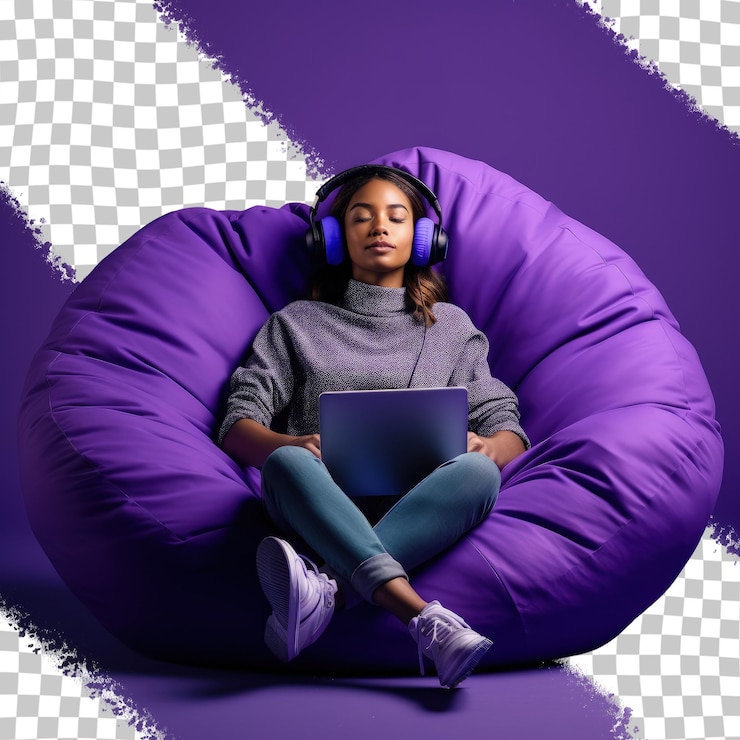 PSD a woman with headphones on and a laptop in a purple bean bag.