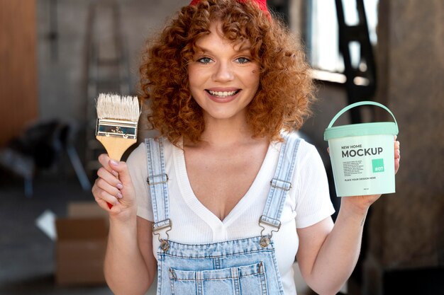 PSD woman with paint bucket mockup