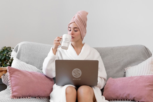 PSD woman working home alone with laptop mockup