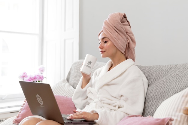 PSD woman working home alone with laptop mockup