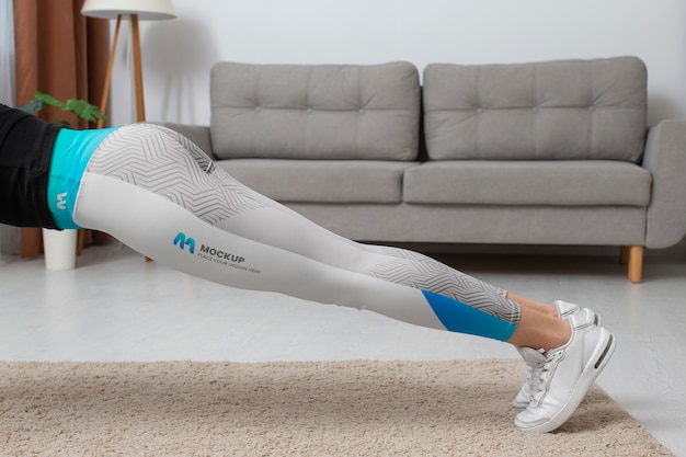 woman working out indoors while wearing leggings
