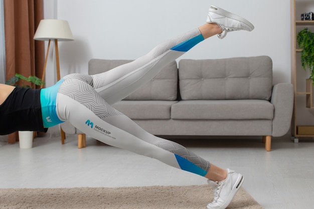 woman working out indoors while wearing leggings