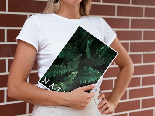 PSD womans hands holding a nature magazine mock up