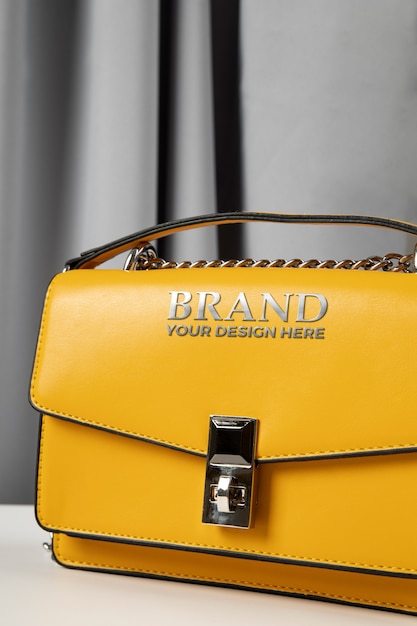 Women's bag embossed golden logo mock-up