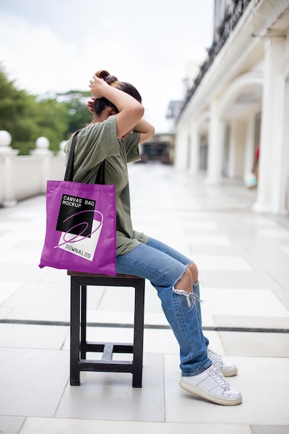 PSD women with canvas bag mockup