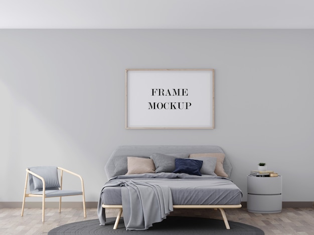 Mockup di cornice a parete in legno sopra il letto grigio