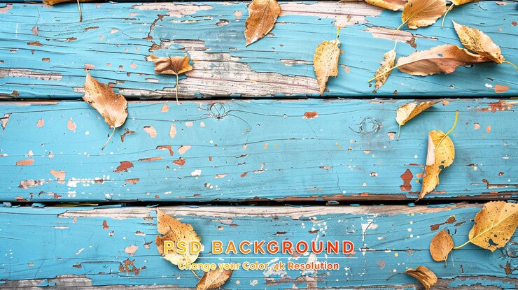 PSD wooden background with autumn leaves laying on it