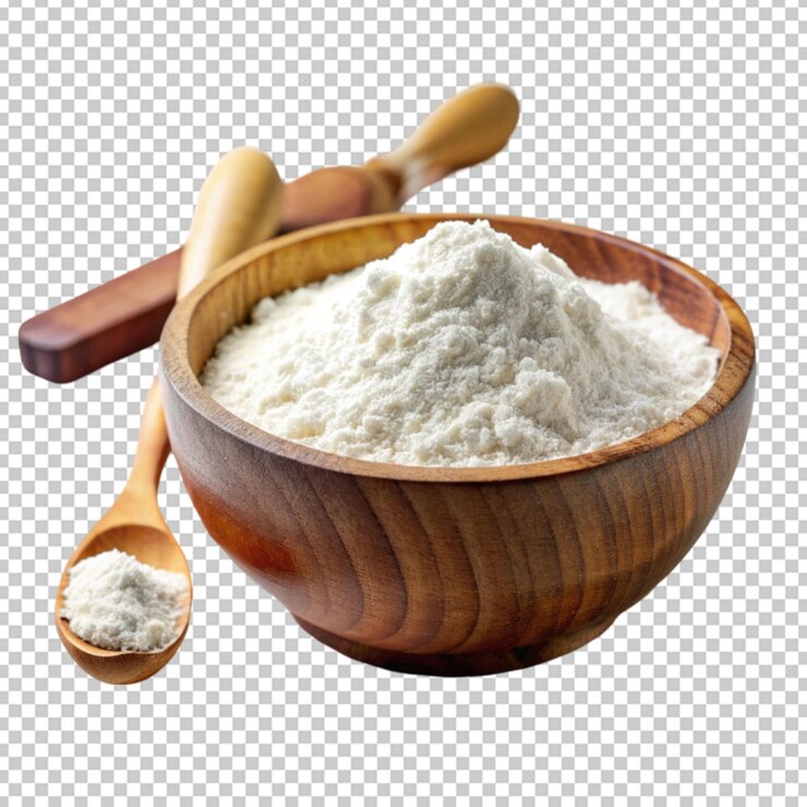 a wooden bowl of flour and wooden spoon on white