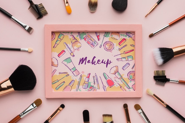 Wooden frame surrounded by makeup brushes