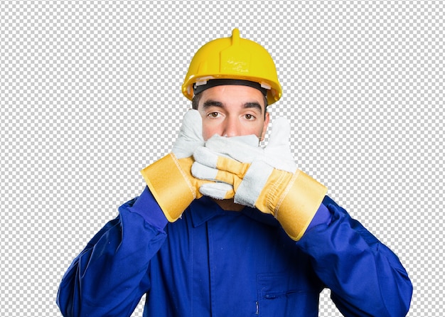 Worker covering his mouth with his hands on white background