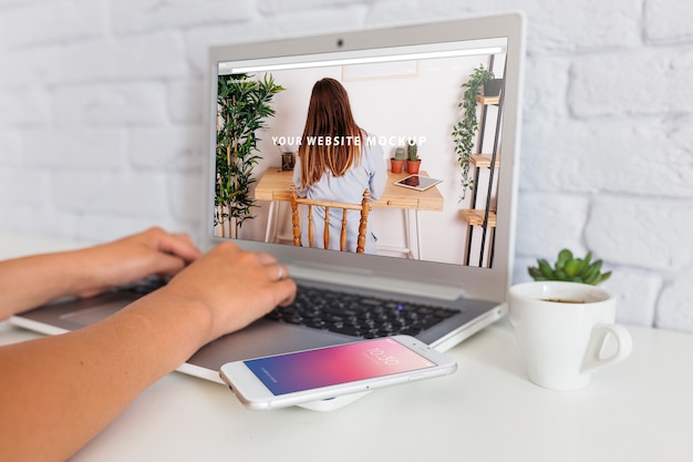 PSD workspace mockup with laptop and smartphone