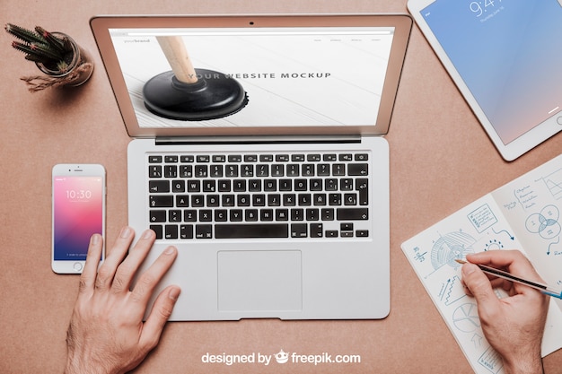 Workspace mockup with laptop and tablet