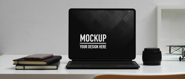 Workspace with digital tablet mockup, coffee cup and supplies