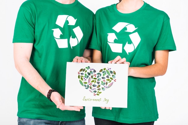 World environment day mockup with volunteer couple holding paper