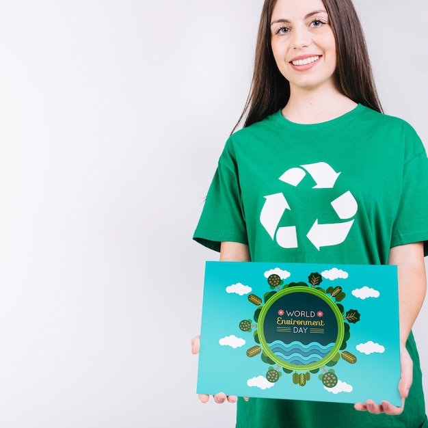 world environment day mockup with volunteer holding paper