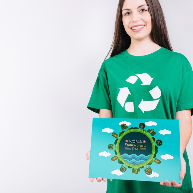 World environment day mockup with volunteer holding paper