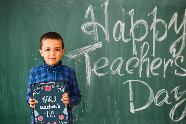 PSD world teacher day mockup with kid holding clipboard