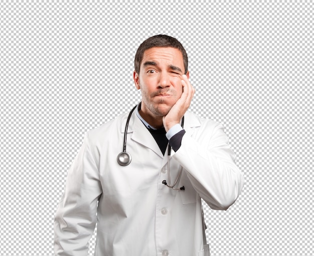 worried doctor with toothache against white background