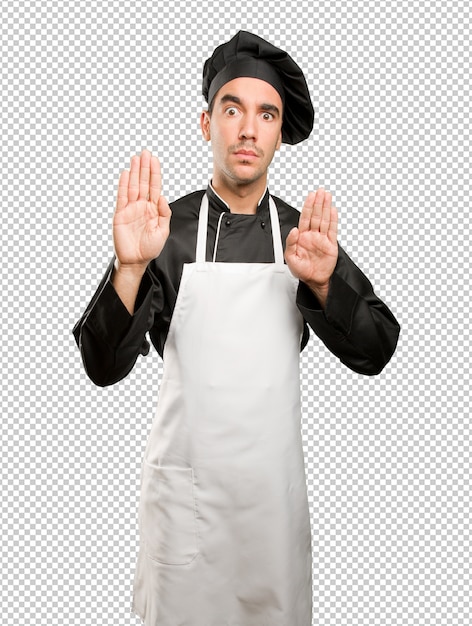 PSD worried young chef doing a prohibition gesture