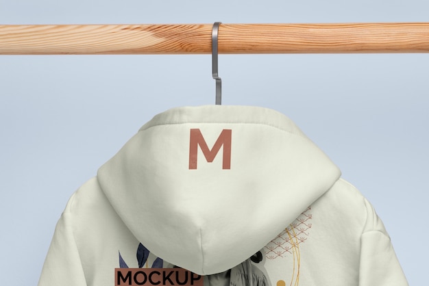 Yellow hoodie on hanger mockup