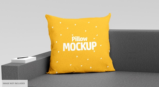 Yellow Square Pillow Mockup with book and pen on Black Sofa