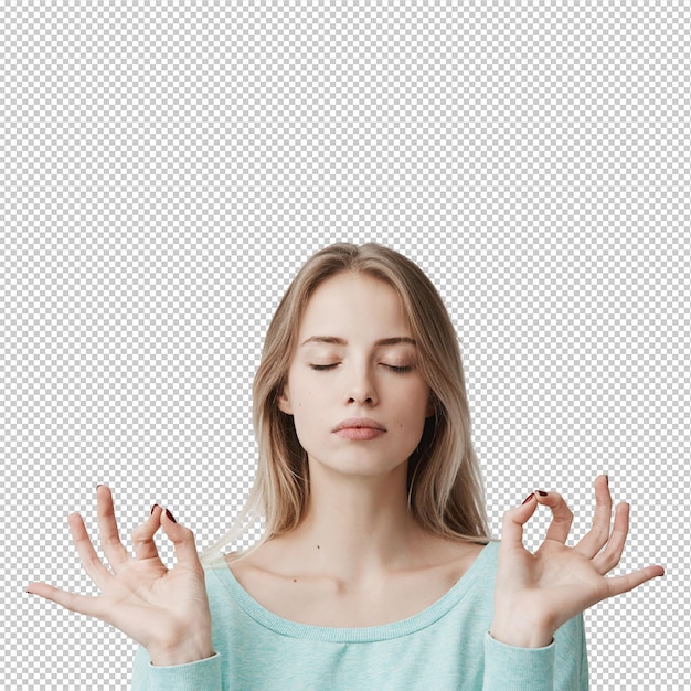 Yoga en een gezonde levensstijl prachtige jonge blonde vrouw gekleed in een lichtblauwe trui houdt haar ogen gesloten terwijl ze binnen mediteert beoefent gemoedsrust houdt haar vingers in mudra gebaar