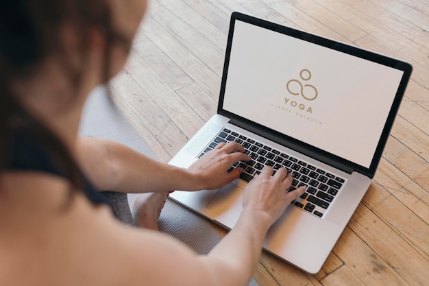 Yogini using a laptop screen mockup