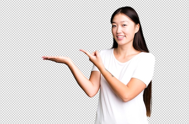 Young adult pretty asian expressive woman with a copy space to the side