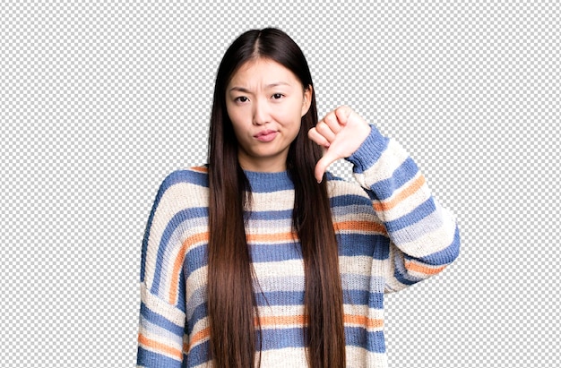 Young adult pretty asian expressive woman with a copy space to the side