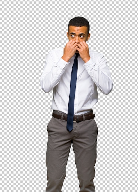 PSD young afro american businessman is a little bit nervous and scared putting hands to mouth