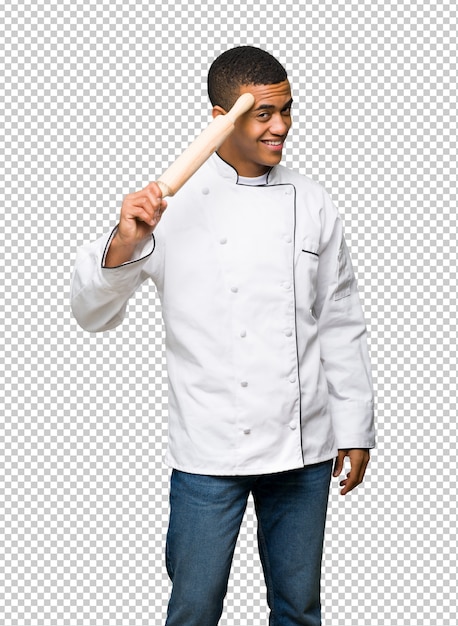 Young afro american chef man saluting with hand