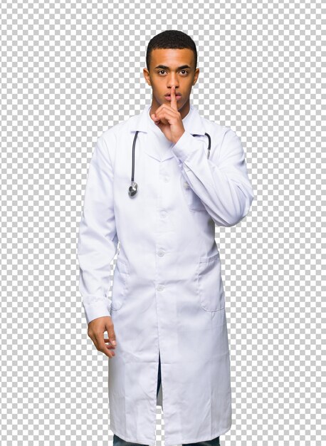 Young afro american man doctor showing a sign of silence gesture putting finger in mouth