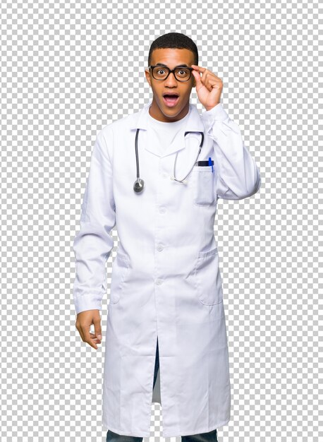 PSD young afro american man doctor with glasses and surprised