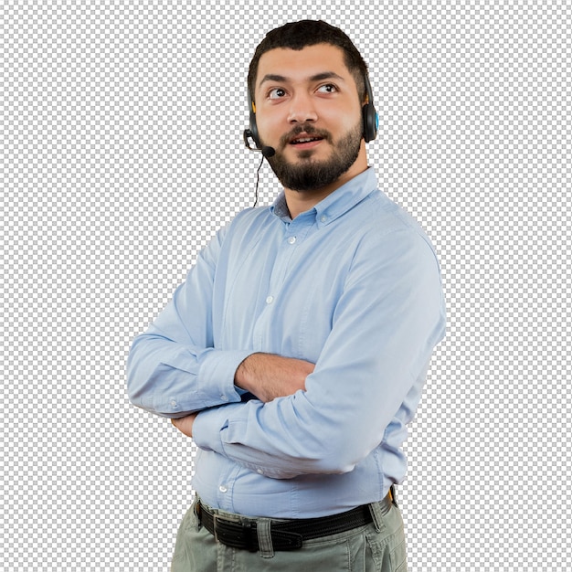 Young bearded man in blue shirt with headphones with microphone looking aside with pensive expression with crossed arms