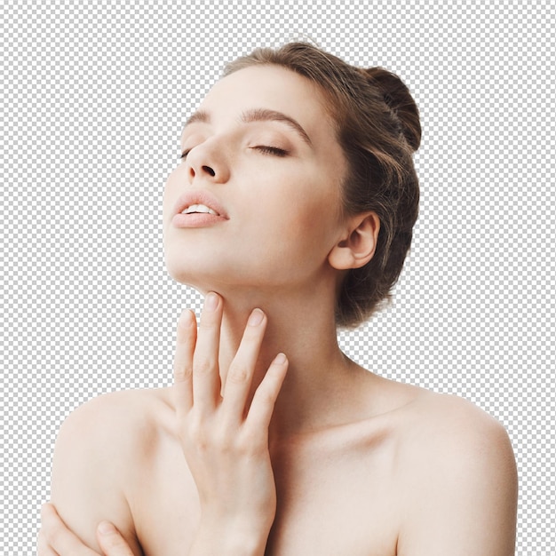 Young beautiful darkhaired caucasian woman with bun hairstyle and naked shoulders raiding head with closed eyes touching neck Girl using body cream after bath