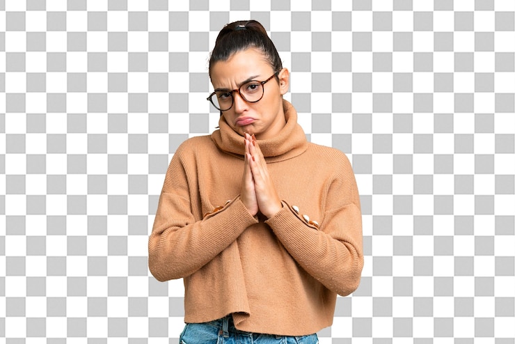 PSD young beauty woman over isolated chroma key background keeps palm together person asks for something