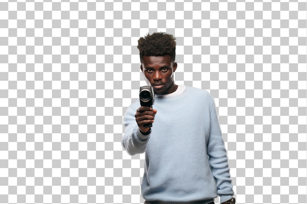 Young black man recording with a super 8 vintage cinema camera