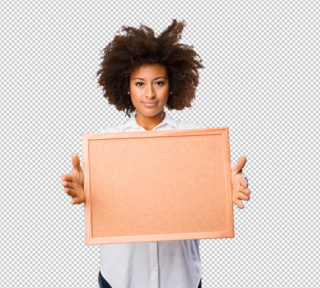 PSD young black woman holding a cork board
