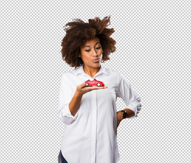 Young black woman holding a red car