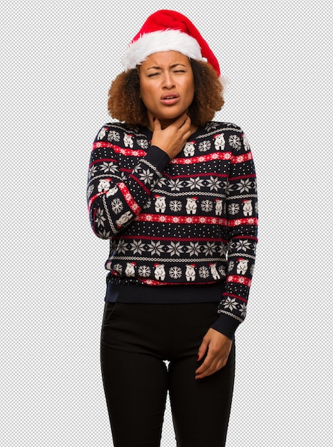 Young black woman in a trendy christmas sweater with print coughing, sick due a virus or infection