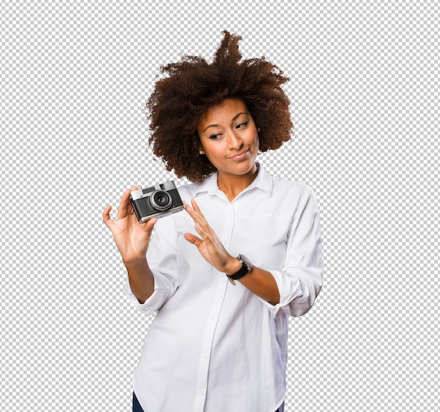 Young black woman using a vintage camera