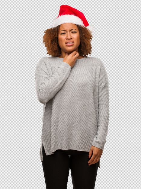 PSD young black woman wearing a santa hat coughing, sick due a virus or infection