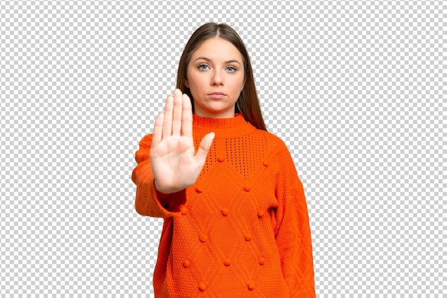 young blonde woman over isolated chroma key background making stop gesture