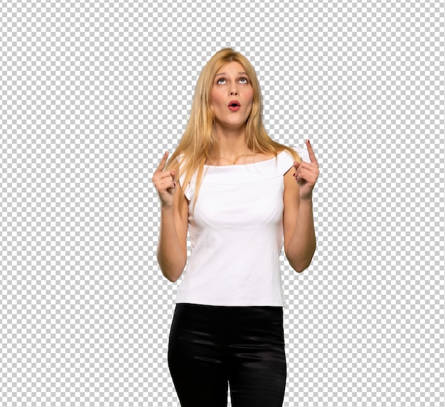 PSD young blonde woman pointing up and surprised