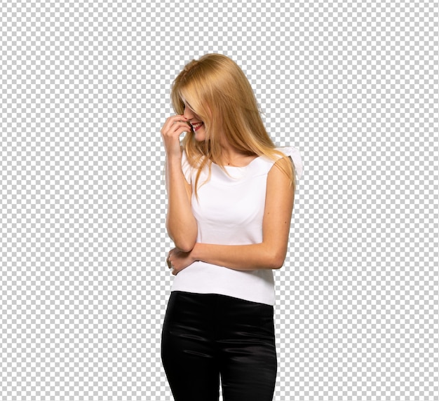 PSD young blonde woman smiling a lot while putting hands on chest