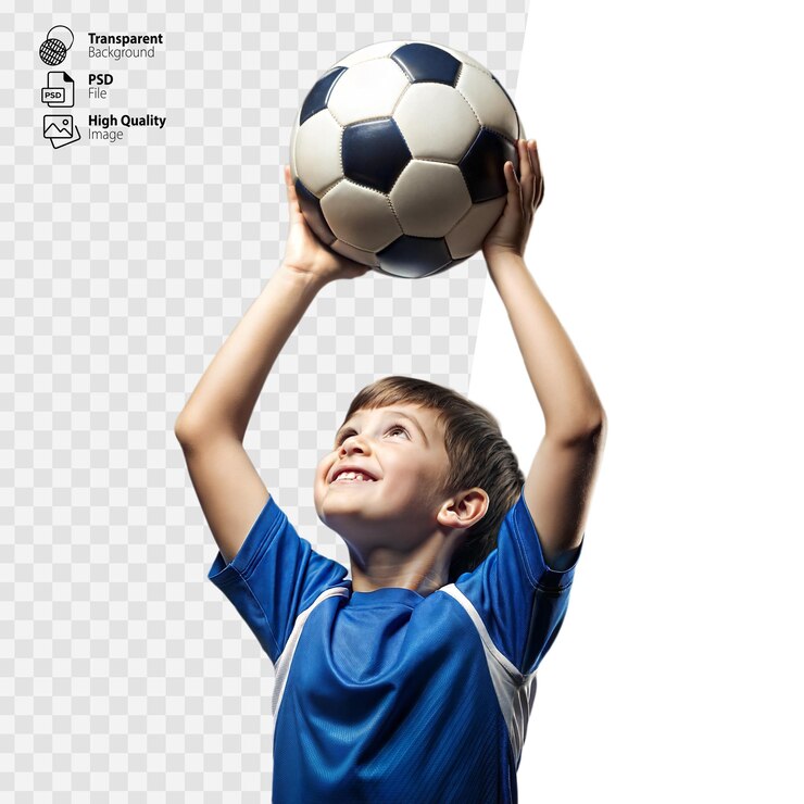 Young Boy Smiling While Holding Soccer Ball Up High