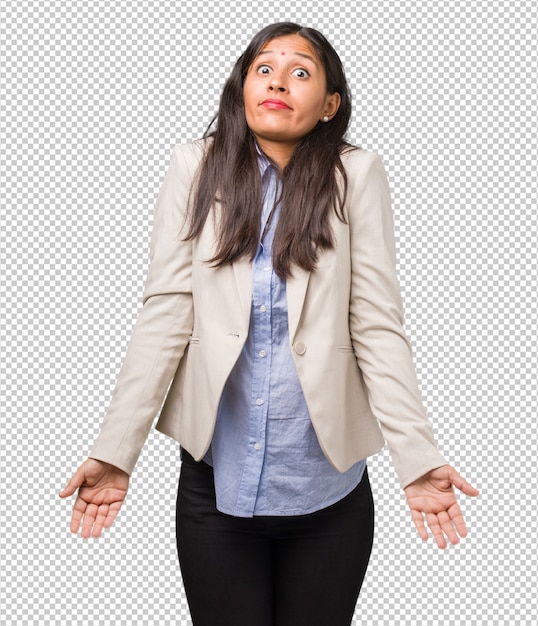 PSD young business indian woman doubting and shrugging shoulders