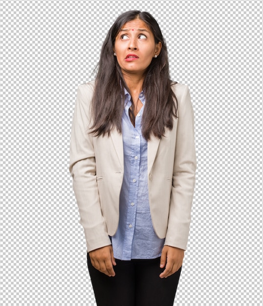 young business indian woman very scared and afraid, desperate for something