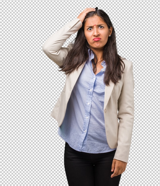 Young business indian woman worried and overwhelmed, forgetful, realize something