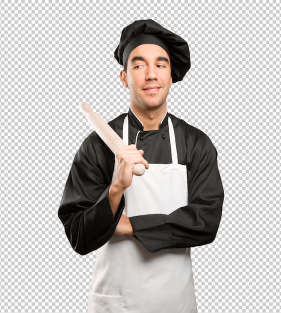 PSD young chef using a cooking utensil with a doubt gesture